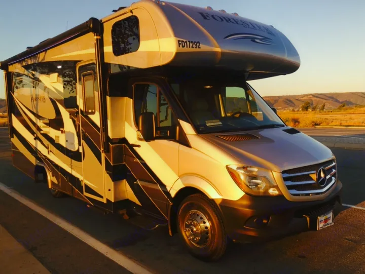 Modern Forester Class C RV rental on a Sprinter chassis, gleaming in golden hour light for your next adventure.. Mercedes Benz Forest River Forester 2017