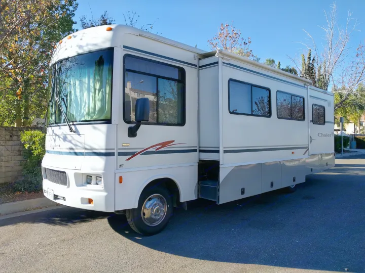 Driver side with slide out from front. Winnebago Sightseer 2004
