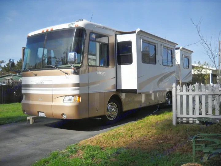 Motorhome features two slide-out rooms in the living and bedroom areas. Monaco Knight 2004