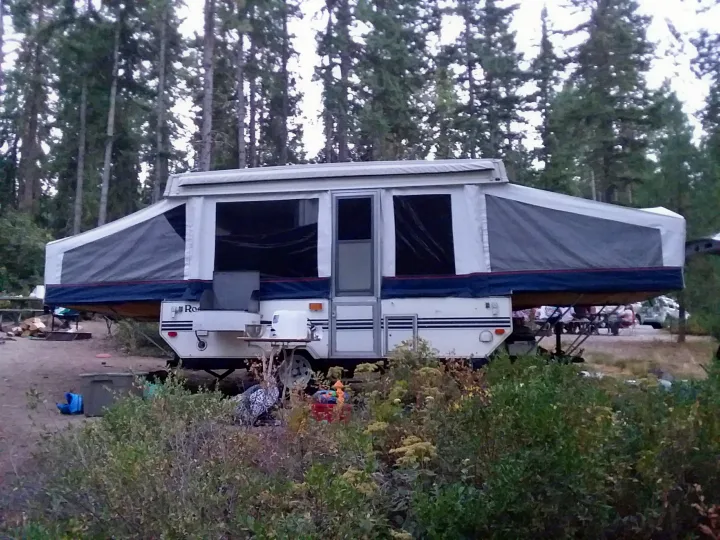 Inside is a king bed, a queen bed, and a table that folds down to make another single bed. Has a fridge, heater, toilet, and sink with warm water.. Rockwood CP 1998