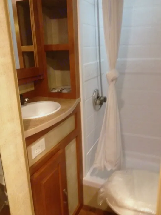 Boast on of the largest bathrooms on a truck camper.. Chalet Rv Oregon Camper 2014