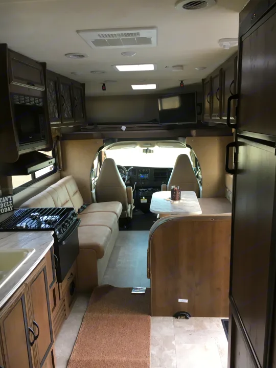Inside this cozy rv rental, see the kitchen. Coachmen Freelander 2018