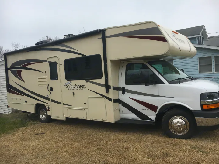 Full view of a beige and. Coachmen Freelander 2018