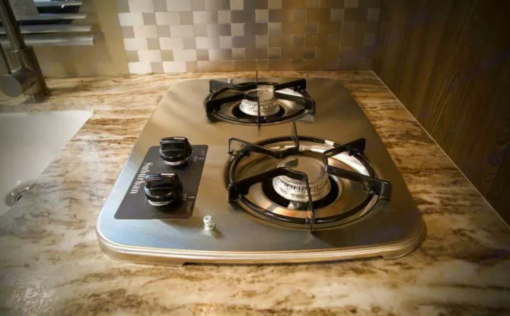RV rental kitchen with a stainless steel two-burner cooktop on a patterned countertop. Ready for your adventures.. Riverside Rv Dream 175BH 2018