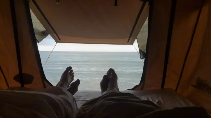Relaxing with an ocean view from your rv rental. Enjoy beachside comfort in a rooftop tent.. toyota tacoma 2023
