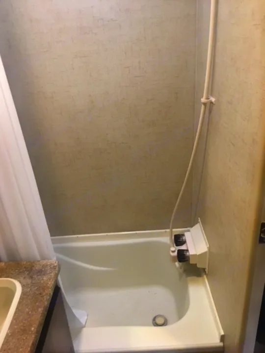 RV rental: Compact bathroom with white shower stall, fixture, and adjacent counter. Functional interior.. KZ SPORTSMEN 2017