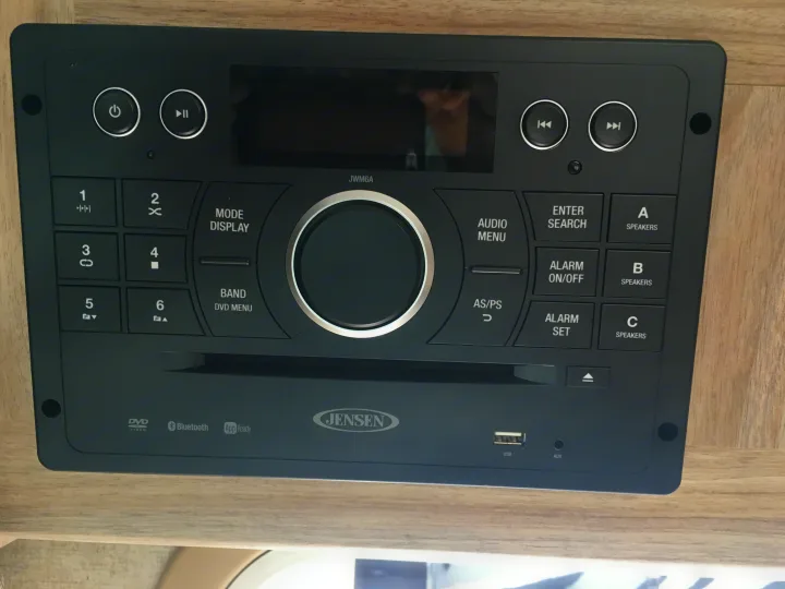 Jensen JWM6A RV audio system in an rv rental. All-in-one entertainment with DVD, Bluetooth, USB, AUX, and speaker zones.. ForestRiver Sunseeker 2018