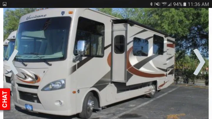 Driver side living room slide extended.. Thor Motor Coach Hurricane 2016