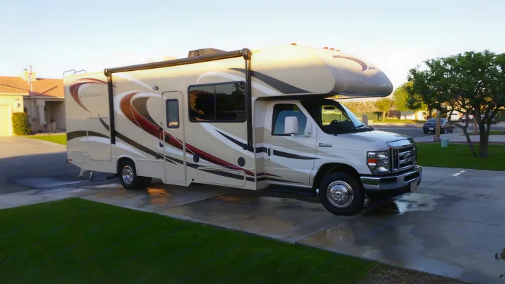 Class C Chateau RV rental parked on a driveway for your next trip.. Thor Motor Coach Chateau 29G 2016