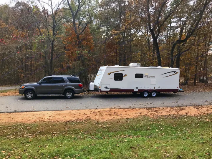 We pull our camper with my wife's Toyota Sequoia OR my Toyota Tundra.  (You must have a trailer brake controller in your vehicle in order to use the camper brakes). Gulf Stream Streamlite 2008