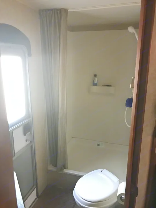 Rear bathroom with large shower. Exterior door allowing access without having to walk through the camper. . Jayco Jay Flight Swift 2014