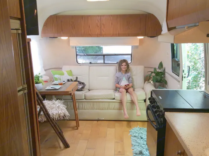 Living area with kitchenette and converting couch / bed.. Airstream Safari 1999
