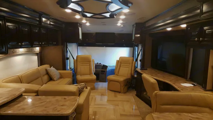 Front lounge area, 32 inch screen TV over driver area, 60 inch screen TV in lounge area with fireplace, work station desk area.. Other Tuscany 2016