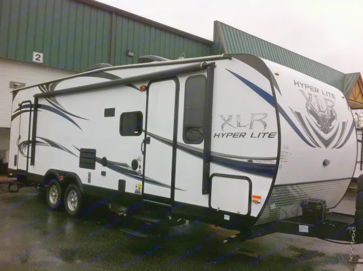 A sleek white XLR Hyper Lite travel trailer, perfect for an rv rental adventure or family camping trips.. Forest River XLR Hyper lite / Delivery only 2014