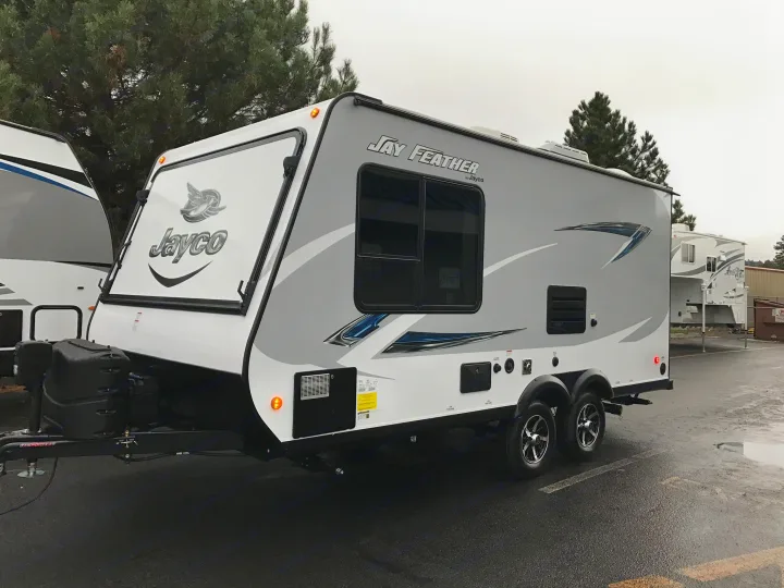 This gray and white Jayco Jay Feather travel trailer RV rental is ready for your next adventure.. Jayco Jay Feather 2017