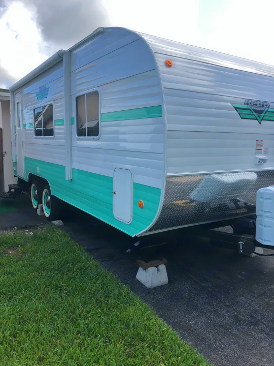 A distinctive teal and white Retro Riverside travel trailer, perfect for an RV rental getaway.. Riverside Rv 189R Retro 2018