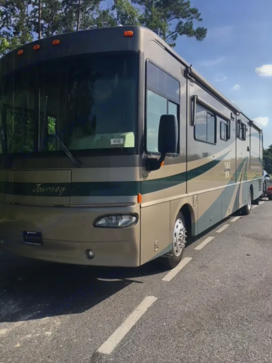 Imagine you and your family going down the road in this luxury motor home.  It is equipped to travel with most of the necessities you will need.  It has inside storage and ample pass through under coach space for all of your extras.. Winnebago Journey 2004