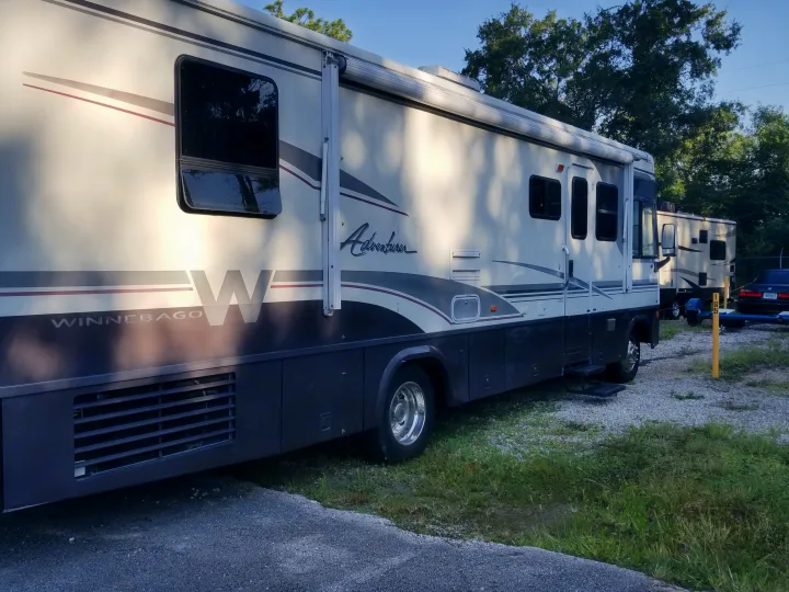 32" side profile with working awning.  (Picture taken while in storage). Winnebago Adventurer 2001