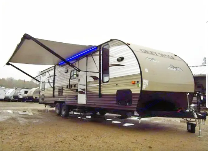 Spacious Grey Wolf travel trailer RV with extended awning & blue lights, ideal for your next rv rental adventure.. Grey wolf Other 2015