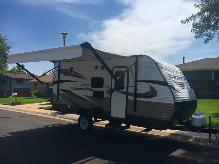 Camper has stabilizing jacks, led lights on canopy, outdoor shower, and outdoor radio. . Starcraft Autumn Ridge 2018