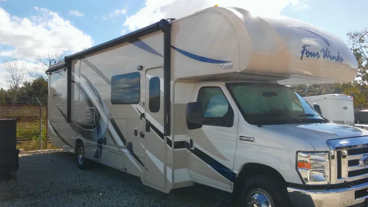 Passenger side - there is an exterior TV on this side. Thor Motor Coach Four Winds 2017