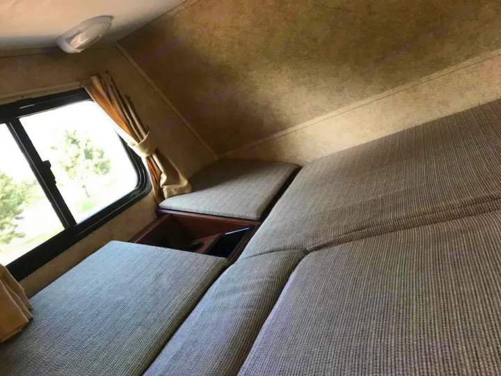 Double bed above drivers seats. Forest River Sunseeker 2014