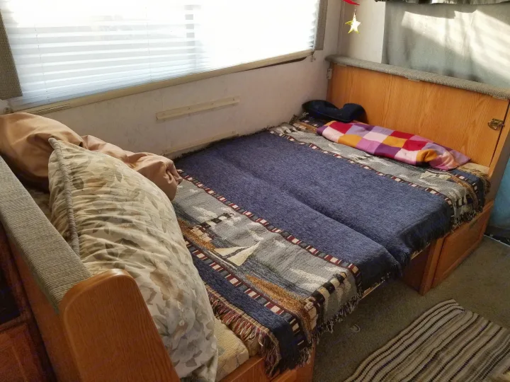 Dinette Table that folds down to make a bed, can sleep 2, depending on size.. Winnebego Mighty Minnie Winnie 2003