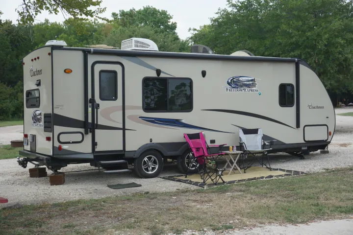 Relax and enjoy the outdoors. Rent this spacious 24' fully equipped travel trailer, hook up and tow it to wherever your next adventure takes you, or rent it at Thousand Trails on Lake Conroe, Conroe, TX and enjoy all the amenities this  RV park has to offer. . Coachmen Freedom Express 2015