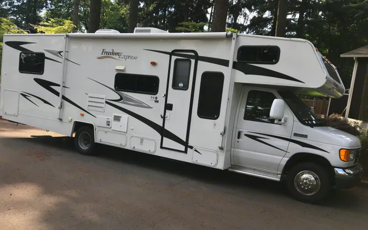 White Freedom Express Class C RV rental with an extended slide-out, ready for travel and adventure.. Other Other 2008