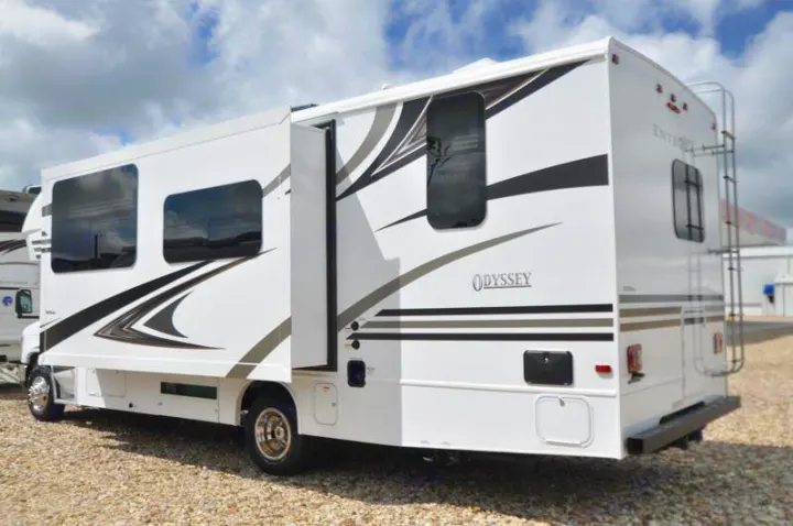 This white Odyssey Class C motorhome, with its black & grey graphic decals, is a perfect rv rental choice.. Other Other 2019
