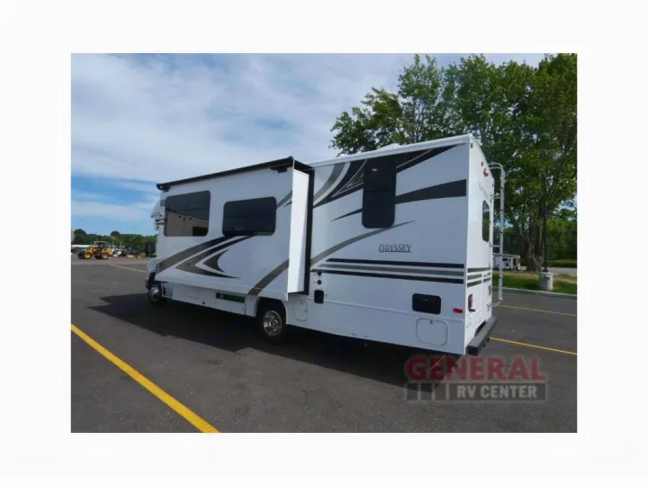 White Odyssey RV rental with extended slide-out, parked on asphalt; ready for your next adventure.. Other Other 2019