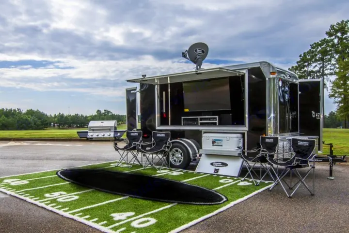 Specialized event **rv rental** trailer with a large TV, satellite, BBQ grill, & football turf for ultimate tailgating.. Horton GameDay Extreme 2018