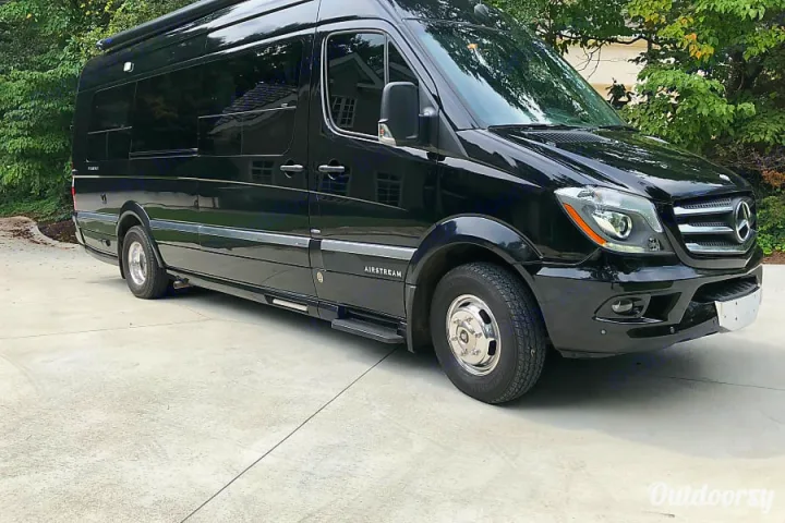 Sleek black Airstream Mercedes Sprinter RV rental. Ready for luxury trips.. Airstream Interstate 2014