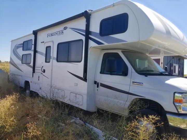 outside and also shows the awning and it has LED strip of lights. Forest River Forester 2017