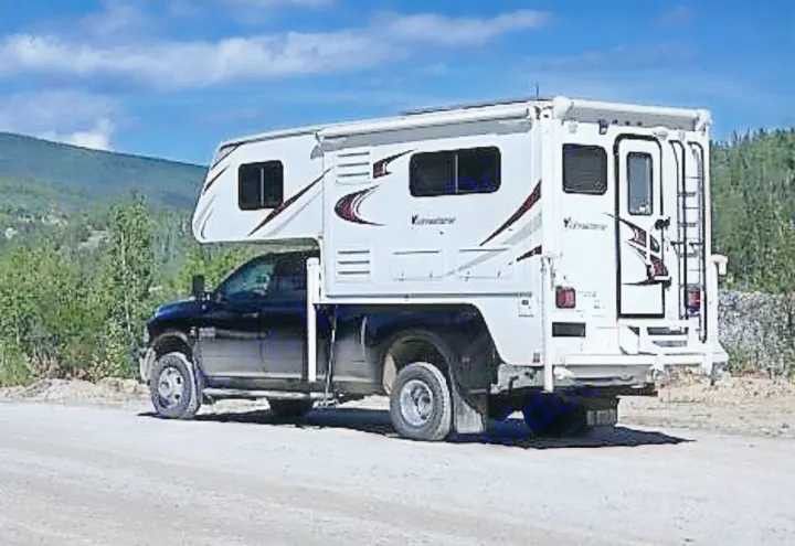 Bonanza Creek Road, Dawson City, Yukon. RAM 3500 SLT 4WD Diesel Dually Truck 2015 ALP Adventurer 910DB Single Slide Camper 2015