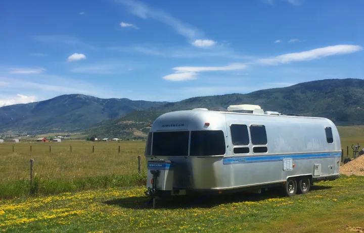 Unhitch and unwind in scenic settings; Shelly sittin' pretty in the mountain landscape of Steamboat Springs CO. Airstream Excella 1997
