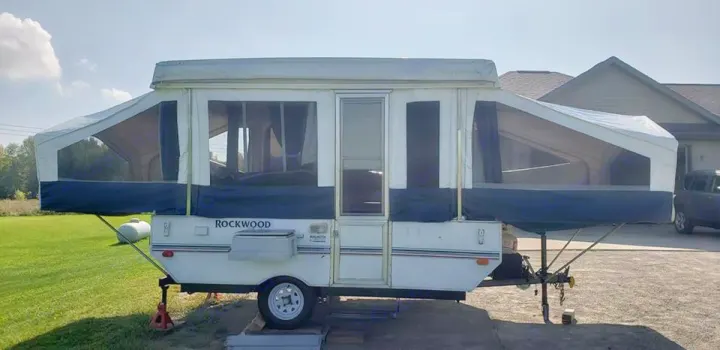 Frontal view of trailer with stove connected exterior. Awning is non-functioning at this time. . Rockwood Freedom 1998