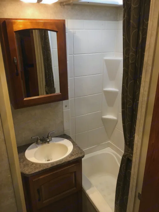 Bathroom with shower/bath. Forest River Surveyor 2011