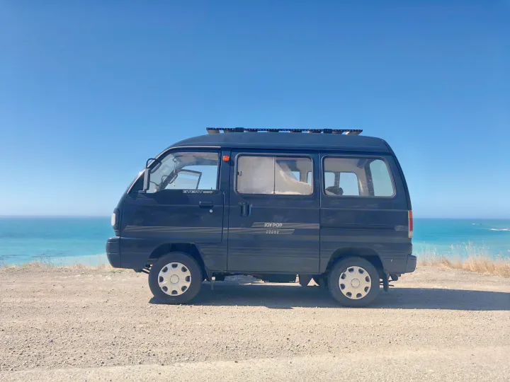Outside at the beach. Perfection! . suzuki every van 1991