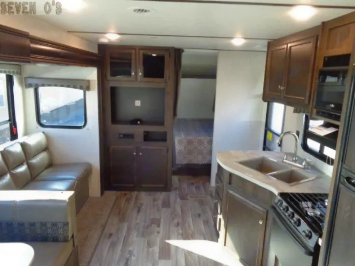 Modern RV rental interior featuring a full kitchen, comfortable living space, and a separate bedroom.. Starcraft Autumn Ridge 27BHS 2018