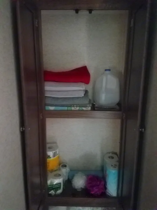 Stay prepared with this RV rental's well-stocked cabinet: towels, water jug, toilet paper, and bath sponges.. Heartland Pioneer 2016