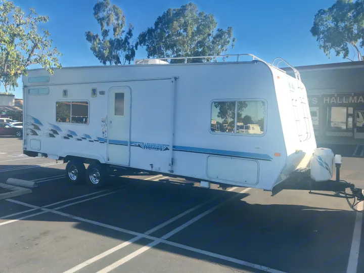 Great Weekend Warrior Hard sided Toy Hauler. You can rent my RV for a weekend trip, or a family vacation. Also leave it where it sits on my property up here in Ramona and Airbnb it if you want. Want an affordable countryside getaway. I live on 2 acres with horses, free range chickens, friendly dogs and kitty cats. You will have access to BBQ, Beautiful pool, Jacuzzi, and sauna. Come stay as long as you like and check out the star filled night without the city lights. . Weekend Warrior FS (front sleeper) 2600 2004