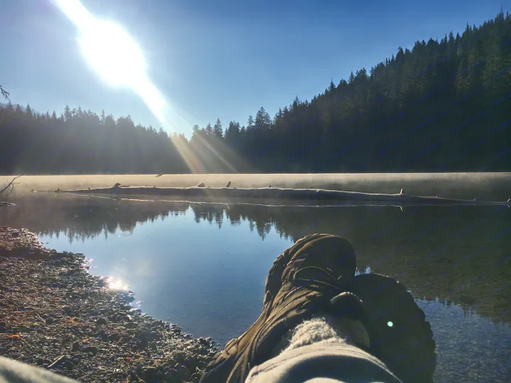 Enjoying serene lake views with morning mist & sunbeams; an ideal RV rental destination.. Forest River Evo 2016