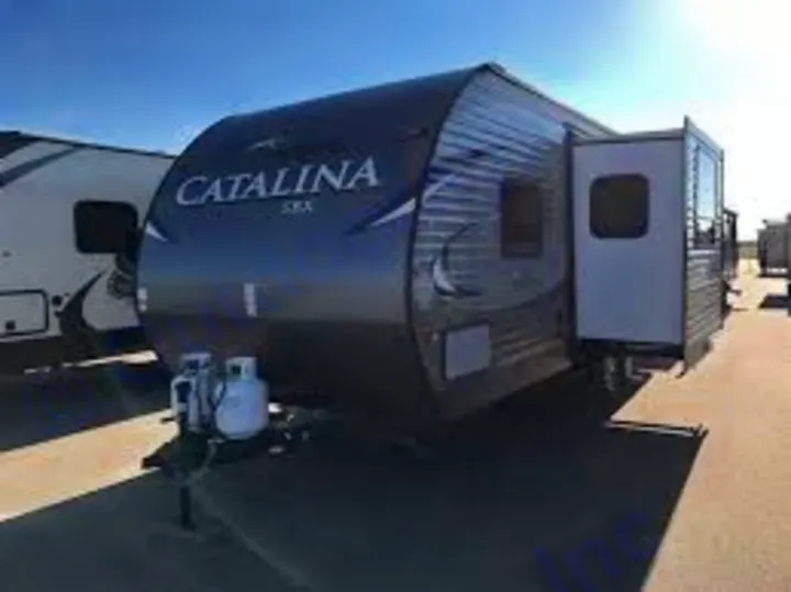 This dark gray travel trailer, great for RV rental, features an extended slide-out. Ready for camping trips and adventure!. Catalina 221TBS 2018