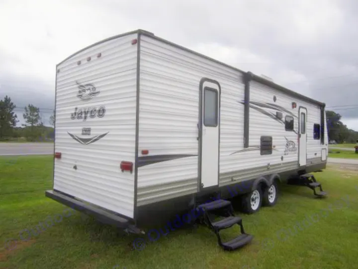 Explore the outdoors with this spacious white Jayco RV rental travel trailer, featuring multiple doors & steps for easy access.. Jay Flight 287 BHSW 2016