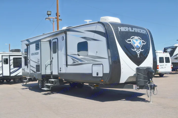 Highlander RV rental: This spacious travel trailer with a black and white exterior is ready for your adventure.. Highland Ridge RV Highlander Toy Hauler 2019
