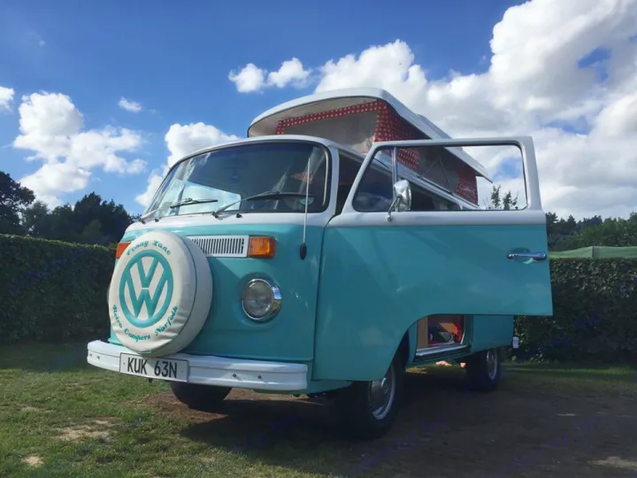 Iconic teal & white VW camper van, "Penny Lane," shown with open door & pop-top. Perfect for an RV rental getaway.. Volkswagen 2.0L T2 Late Bay 1975