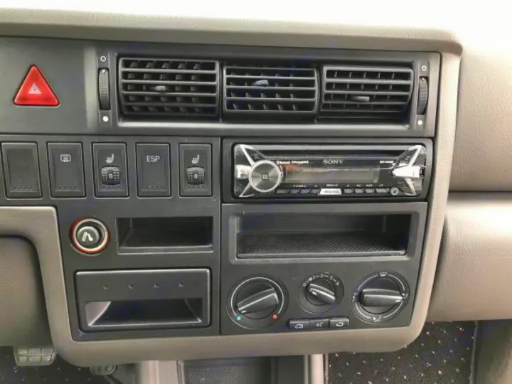 RV rental interior dashboard featuring a Sony car stereo, manual climate controls, hazard light, and heated seat buttons.. Volkswagen Westfalia 2002