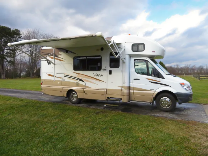 Exterior with electric awning extended . Winnebago View 2011
