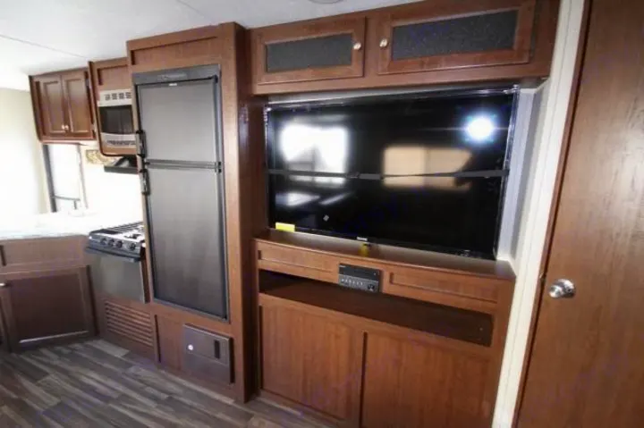 Big Screen Television and surround sound entertainment system viewable from entire living, dining and bunk rooms.  . Keystone Hideout 2017